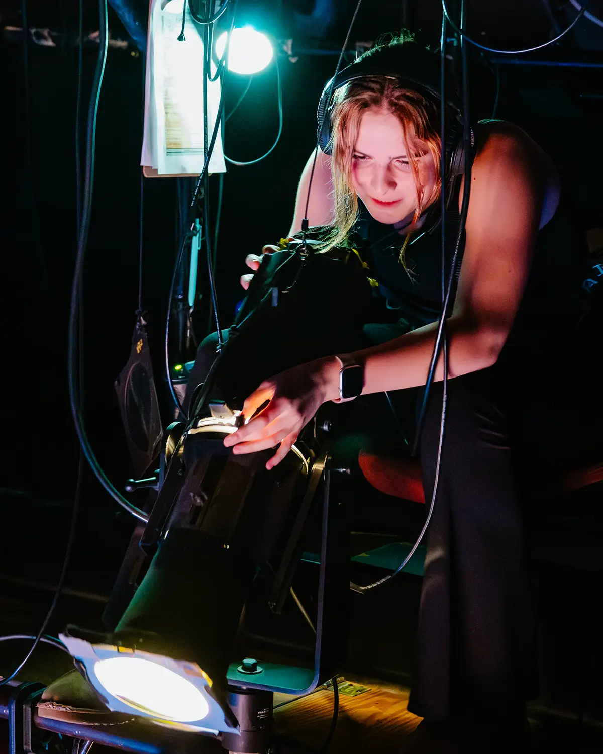 A crew member working on lighting