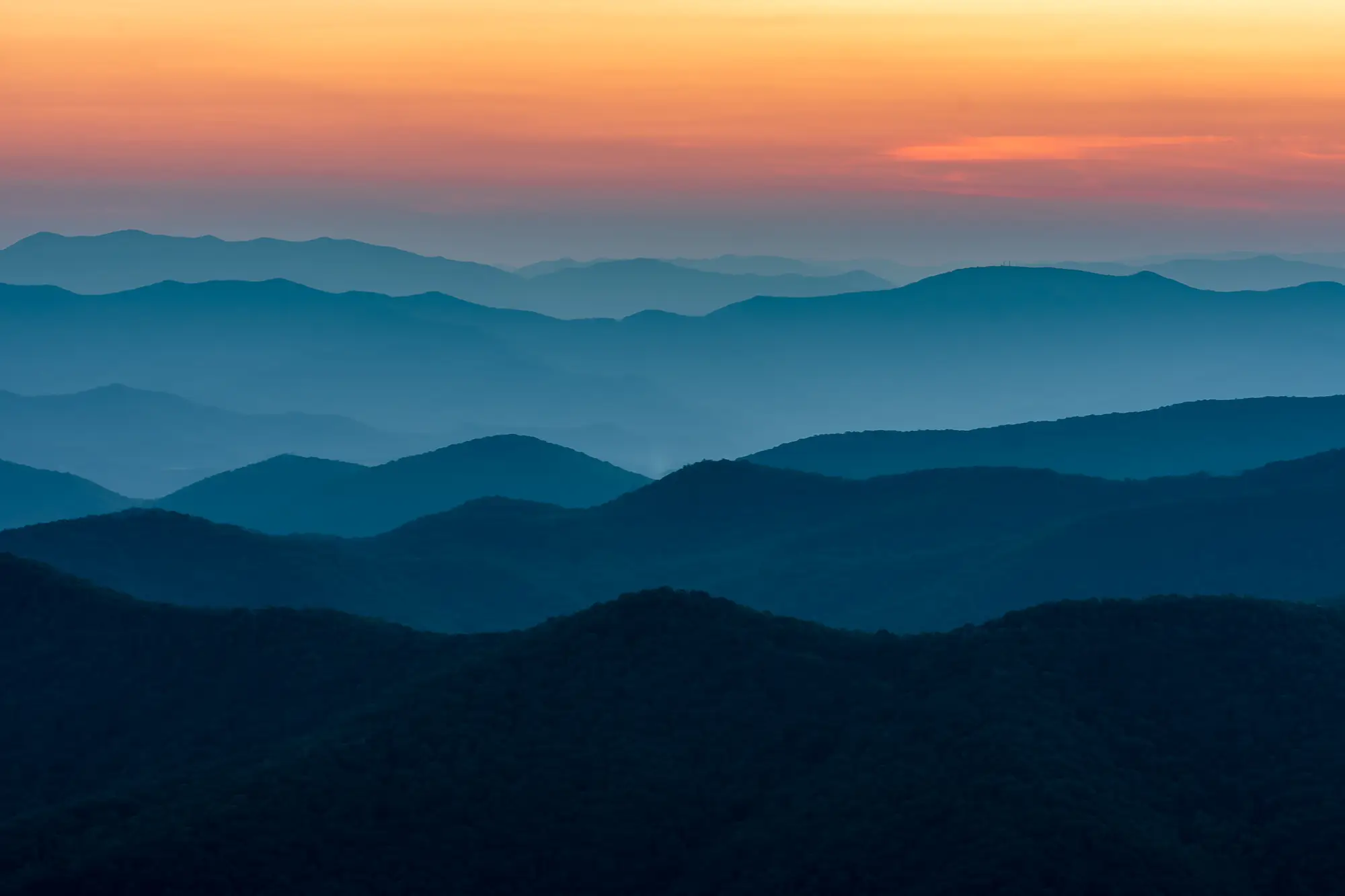 A graphic illustration of a mountainous landscape