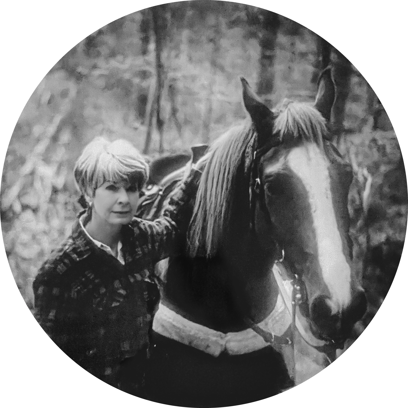 A black and white photo of a woman with a horse