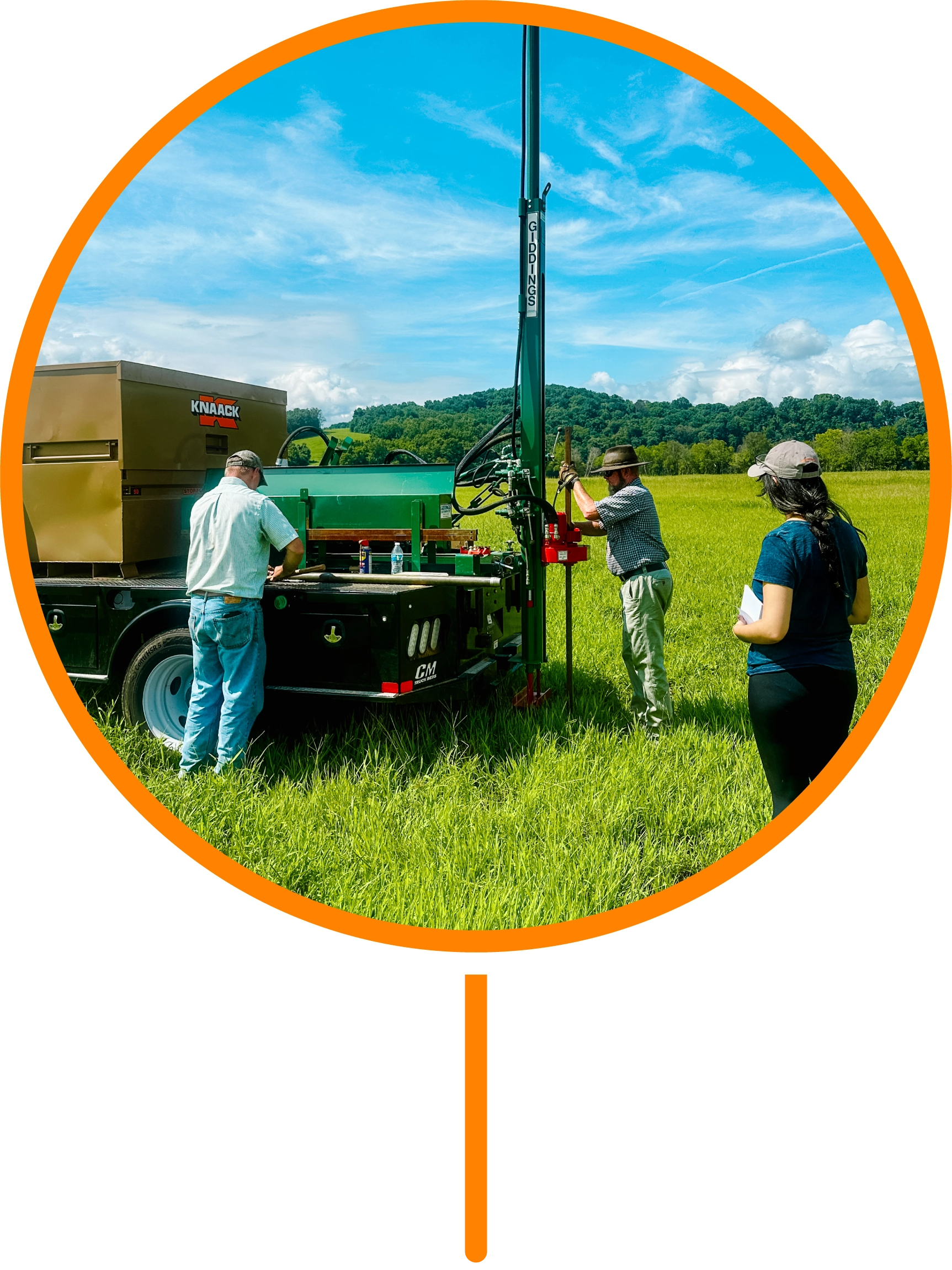 People working on scientific instrumentation on the back of a truck