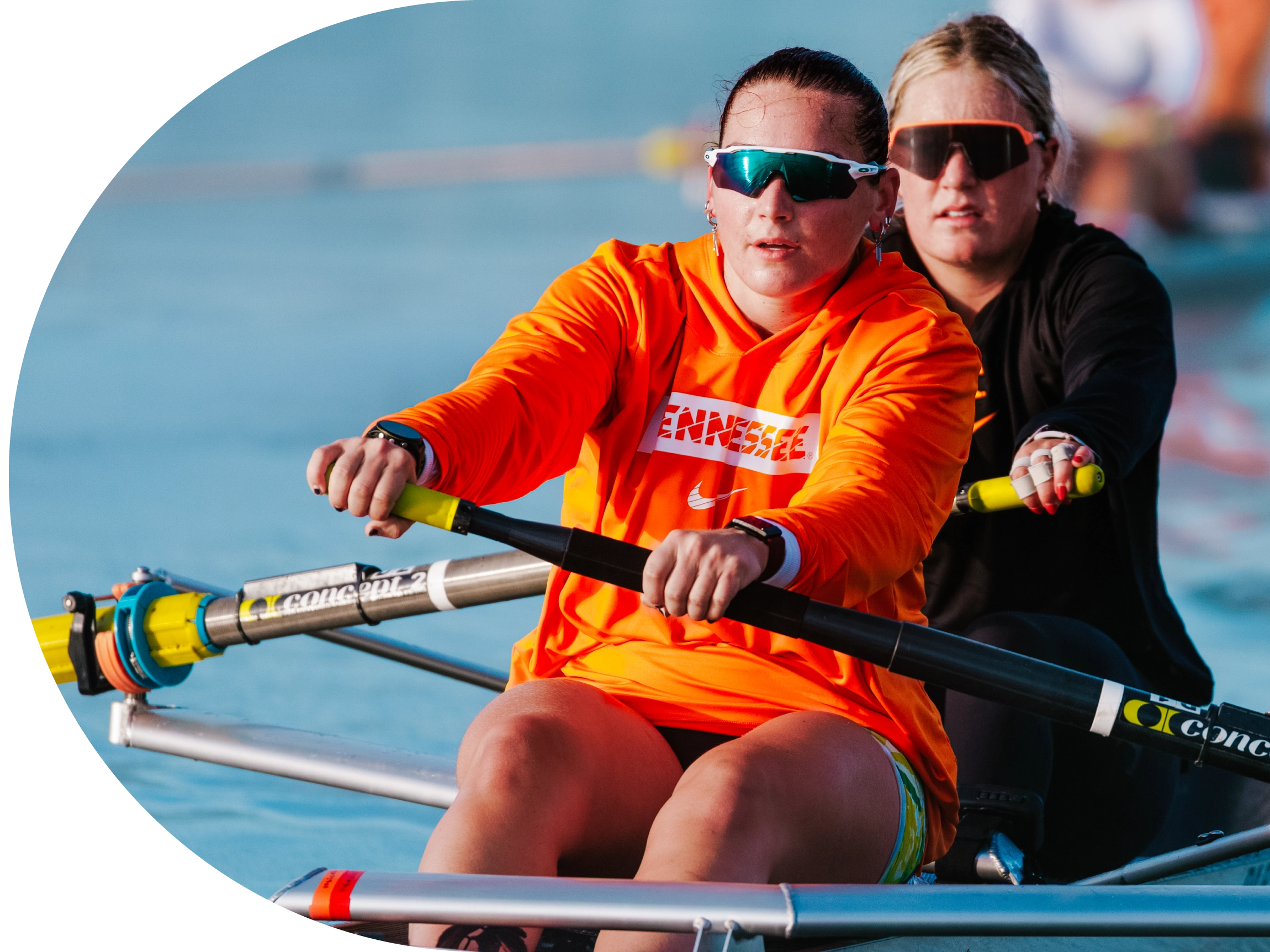 Athletes from the women's rowing team on the water